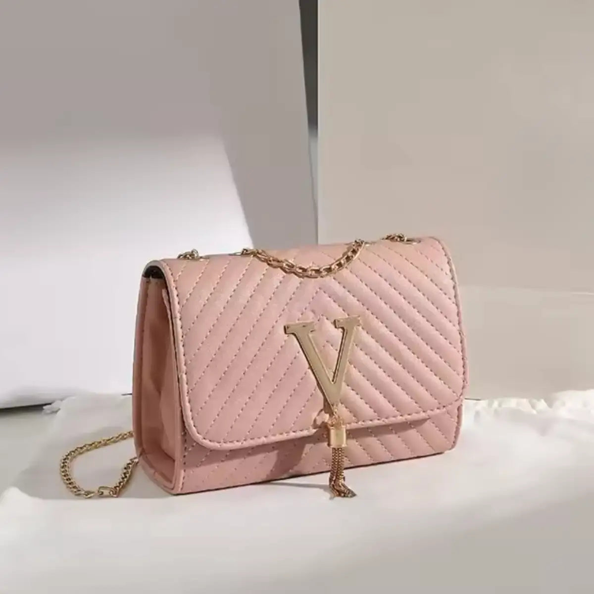 compact quilted crossbody purse for parties and evenings pink