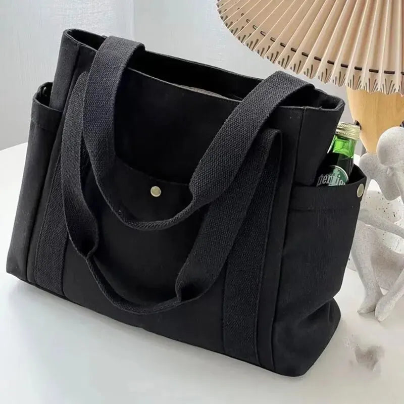 casual canvas tote bag with open side and front pockets