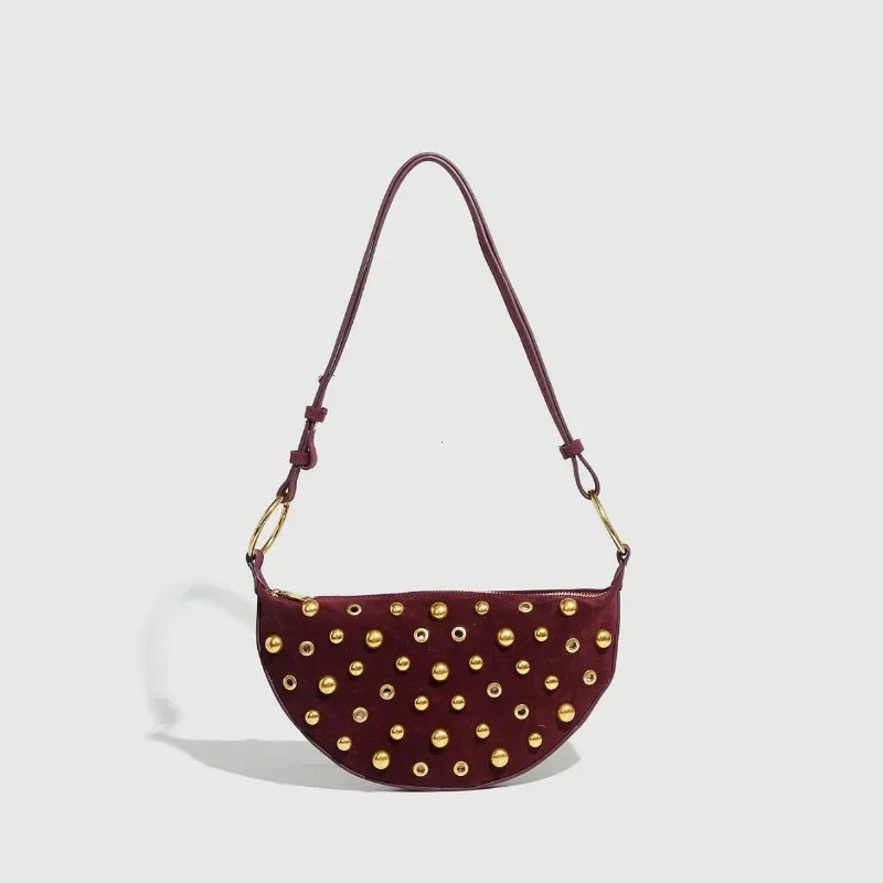 retro crossbody purse with metal charm and rivets